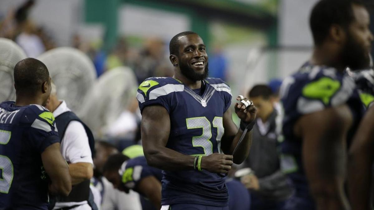 Seattle Seahawks strong safety Kam Chancellor (31) stands on the sideline during a preseason NFL football game against the Dallas Cowboys, Thursday, Aug. 25, 2016, in Seattle.