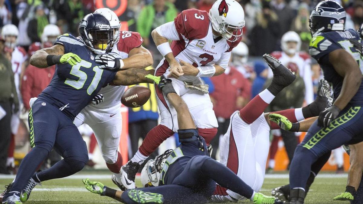 Seahawks linebacker Bruce Irvin (51) forces a fumble from Cardinals quarterback Carson Palmer during a Nov. 15 game in Seattle. Irvin, a 2012 first-round pick of the Seahawks, will be a free agent after the season.