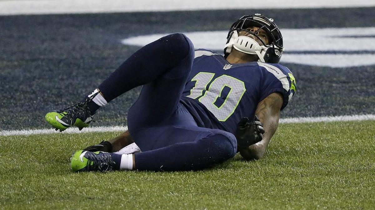 Seattle Seahawks wide receiver Paul Richardson (10) lays on the ground after injury his left knee in divisional playoff game against Carolina on Jan. 10 in Seattle. Richardson suffered his second serious knee injury in three years.