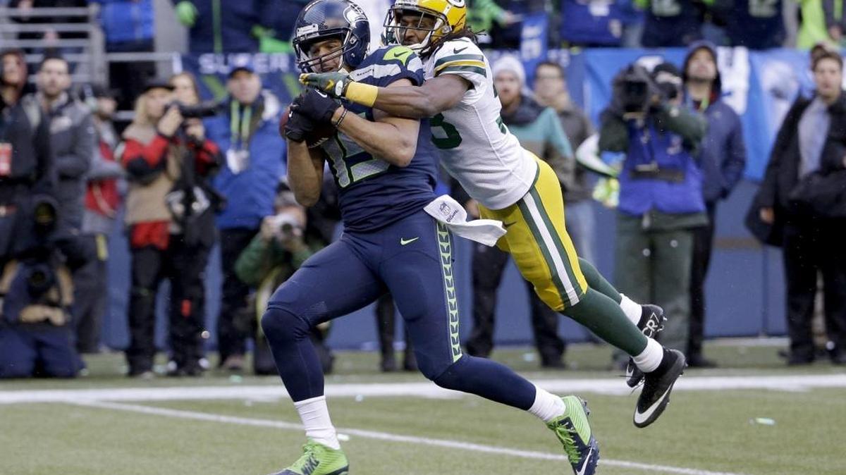 Seattle’s Jermaine Kearse catches the game-winning touchdown pass in front of Green Bay’s Tramon Williams during overtime of the NFC Championship game Jan. 18, 2015, in Seattle. The Seahawks won 28-22 to advance to Super Bowl XLIX.