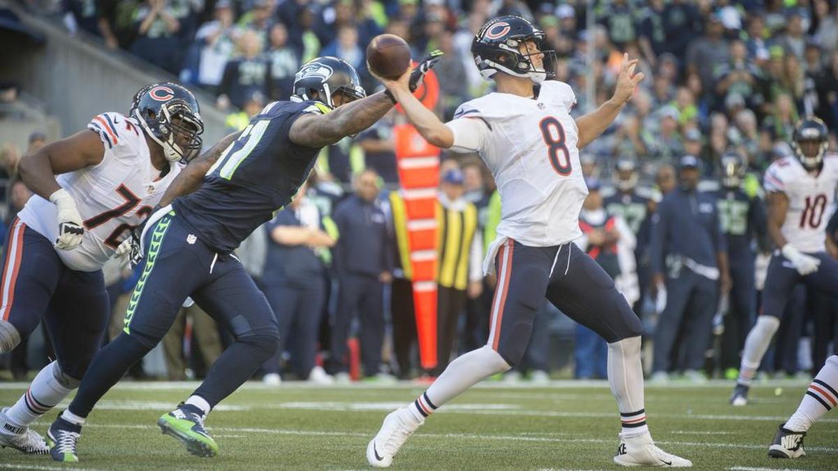 Seahawks linebacker Bruce Irvin pressures Bears quarterback Jimmy Clausen during Sunday's NFL football game against the Chicago Bears at CenturyLink Field in Seattle on Sunday, Sept. 27, 2015.