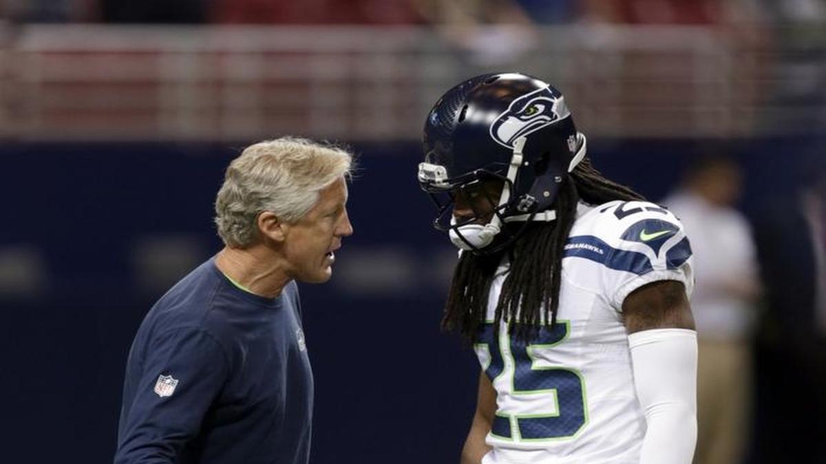 
Seahawks All-Pro cornerback Richard Sherman and coach Pete Carroll talk before the opening-season loss at St. Louis on Sunday. Seattle’s defense allowed 34 point, its most in 35 games
