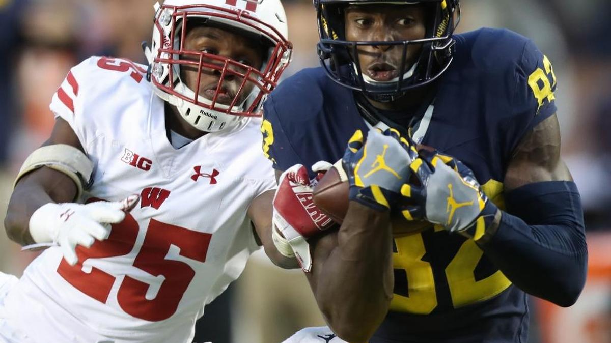 Michigan’s Amara Darboh, right, makes the game-winning catch against Wisconsin’s Derrick Tindal during second-half action on Saturday, Oct. 1, 2016, at Michigan Stadium in Ann Arbor, Mich. The Wolverines won, 14-7, as Darboh scored on the 46-yard reception.