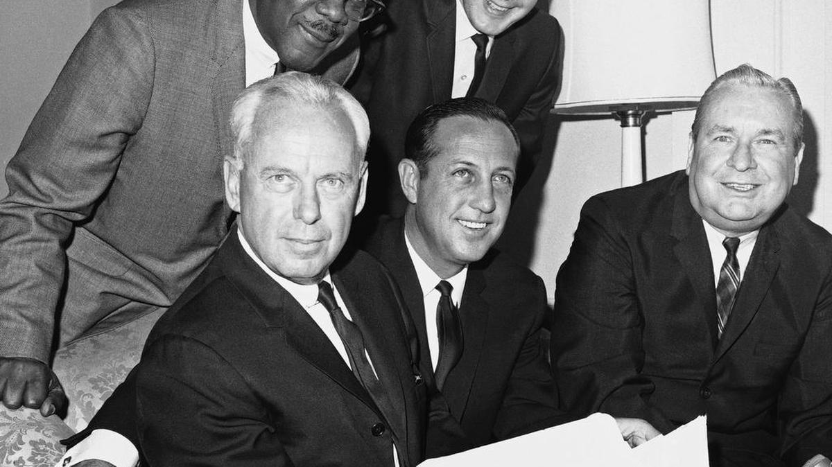 American Football League president, Milt Woodward, seated left, poses on May 24, 1967 at the Waldorf Astoria Hotel in New York City after it was announced Cincinnati would be awarded the 10th franchise in the AFL and would begin play in the 1968 season. With him are: Pete Rozelle, seated center, pro football commissioner; Ohio Governor James Rhodes, seated right; Myron B. Bush, left-rear, Cincinnati city councilman and Eugene Ruehlmann, Cincinnati vice mayor.