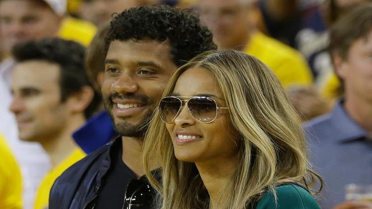 Seahawks quarterback Russell Wilson and Ciara, here at Game 7 of the NBA Finals in Oakland, Calif., last month, reportedly got married Wednesday at a 19th-century castle next to a forest in the English countryside.