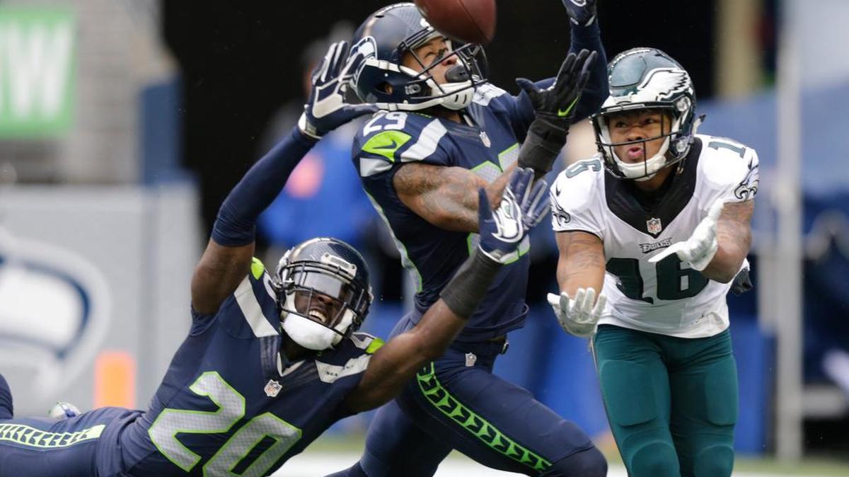 Seattle Seahawks cornerback Jeremy Lane (20) and free safety Earl Thomas, center, break up a pass intended for Philadelphia Eagles wide receiver Bryce Treggs on Sunday, Nov. 20, 2016, in Seattle.