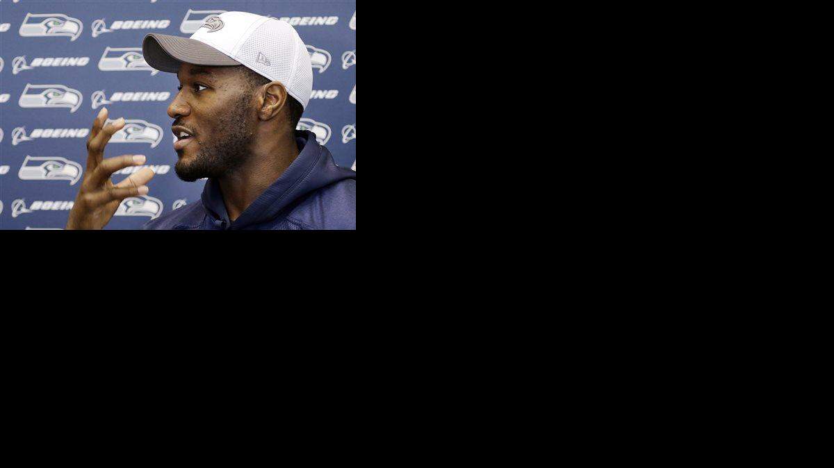 FILE - In this Jan. 16, 2014, file photo, Seattle Seahawks' Derrick Coleman speaks with members of the media about how he can read lips, before an NFL football practice in Renton, Wash. Seattle Seahawks fullback Derrick Coleman has been arrested and is under investigation of vehicular assault and felony hit-and-run. According to jail records, Coleman was booked into King County Jail in Seattle early Thursday, Oct. 15, 2015, and bail was denied. Coleman, who is legally deaf, is in his fourth season with the Seahawks.
