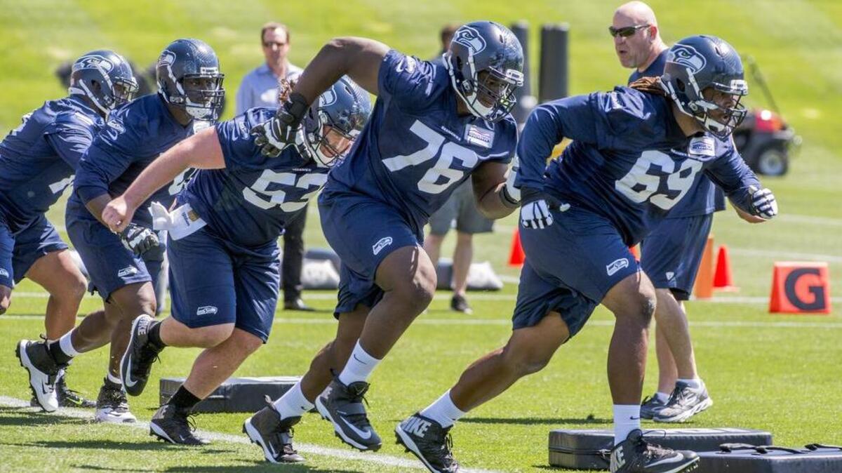 Offensive lineman Germain Ifedi (76) follows tackle Terry Poole (69) and runs in front of center Joey Hunt during practice at the Seattle Seahawks weekend rookie minicamp at the Virginia Mason Athletic Clinic in Renton. Ifedi is expected to play at right guard this season.