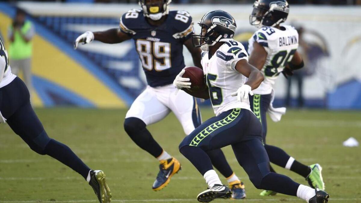 
Watching Seahawks rookie Tyler Lockett, second from right, returns a punt for a touchdown against the San Diego Chargers on Saturday brought back memories for columnist John McGrath of another speedster who came to the NFL via Kansas.

