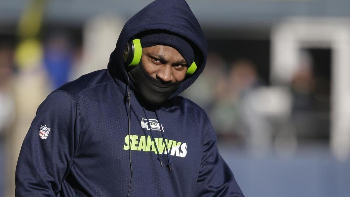 Seattle Seahawks running back Marshawn Lynch wears a mask during during warmups before an NFL football game against the San Francisco 49ers, Sunday, Nov. 22, 2015, in Seattle.