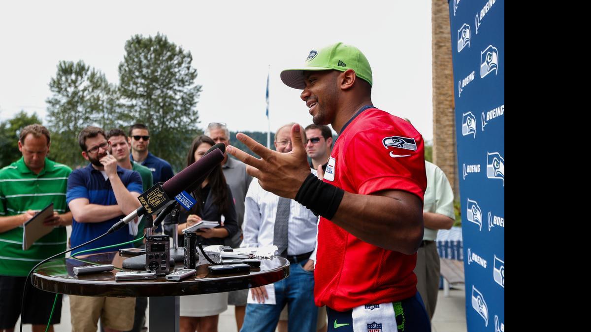 
Seattle Seahawks quarterback Russell Wilson, right, says of taking out an insurancee policy because he potentially could play the upcoming season without a new contract, “That’s just being smart. If I do have to play this season (without a new contract), that’s just being smart. That’s all that is, really. I think that’s the right thing to do.”
