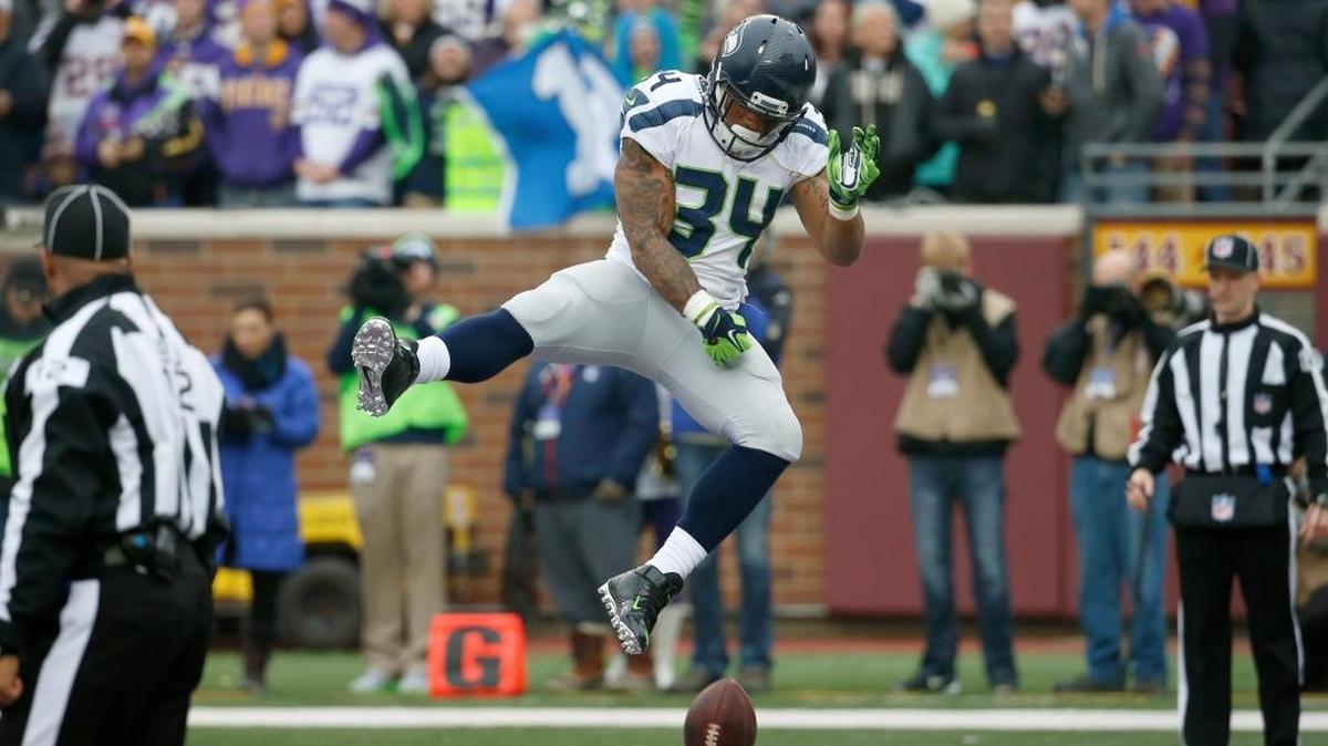 Seattle Seahawks running back Thomas Rawls celebrates his five-yard touchdown run against the Minnesota Vikings in the first half of an NFL football game Sunday, Dec. 6, in Minneapolis.