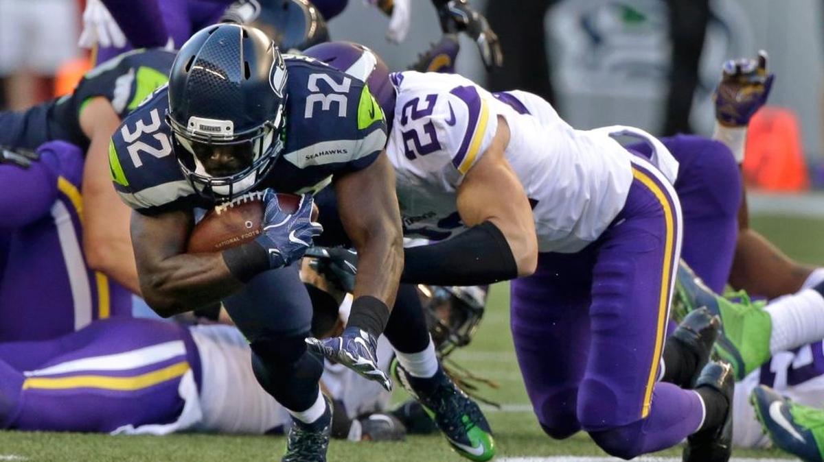Seattle Seahawks running back Christine Michael (32) is tackled by Minnesota Vikings free safety Harrison Smith during the first half of a preseason NFL football game Thursday, Aug. 18, 2016, in Seattle.