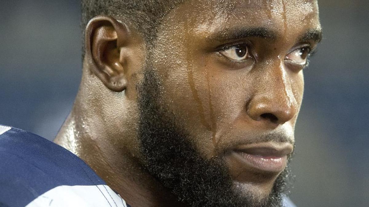Sweat rolls off Seattle safety Kam Chancellor's face as he answers questions after the game. Photo taken in Seattle on Monday, Oct. 5, 2015.
