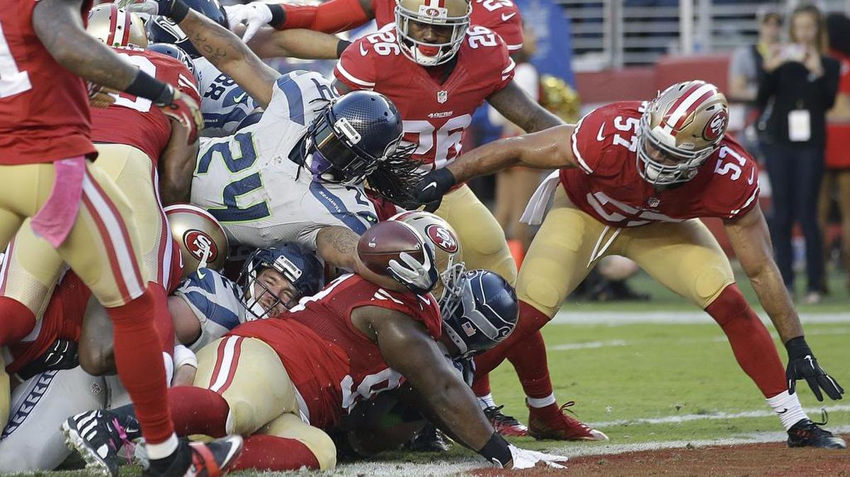 Seattle running back Marshawn Lynch (24) runs for a 1-yard touchdown against San Francisco during the first half Thursday, Oct. 22, in Santa Clara, Calif.