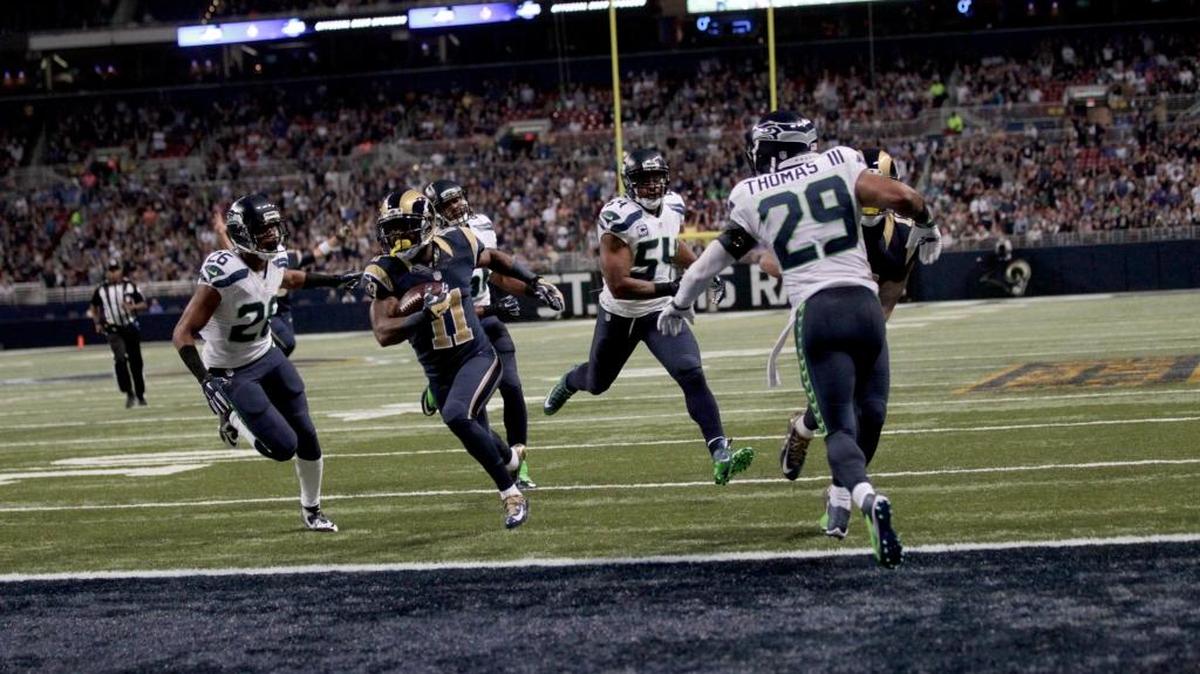 
Rams wide receiver Tavon Austin (11) runs to the end zone past Seahawks defenders Cary Williams (26), Bobby Wagner (54) and Earl Thomas (29). It was one of many defensive breakdowns on the day for the Seahawks.
