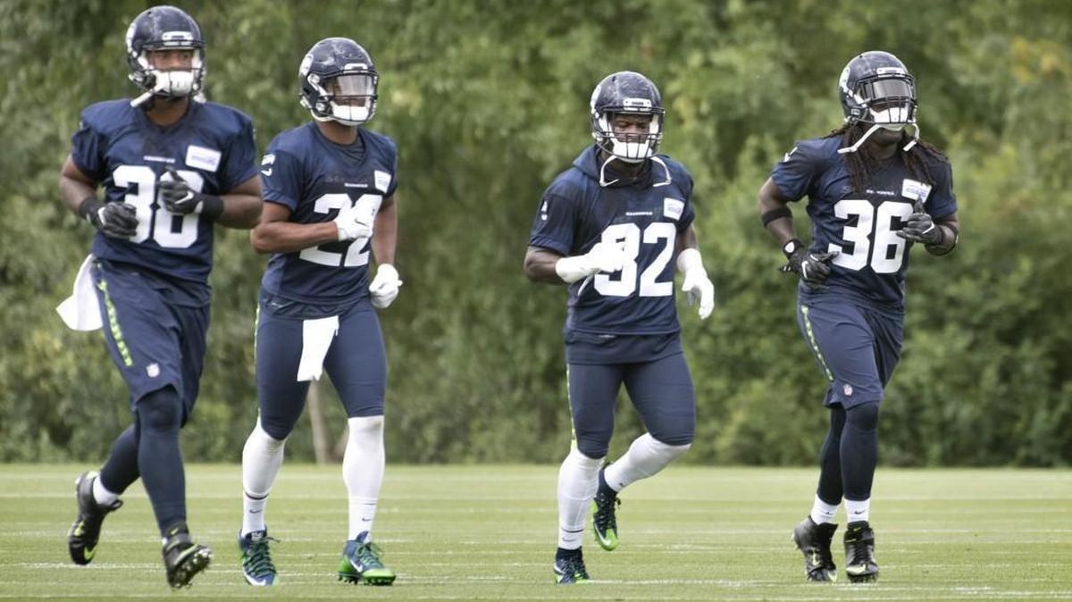 Seahawks rookie running backs Alex Collins (36) and C.J. Prosise (22) have been impressive in the early days of training camp. Also pictured: Tre Madden (38) and veteran Christine Michael (32).