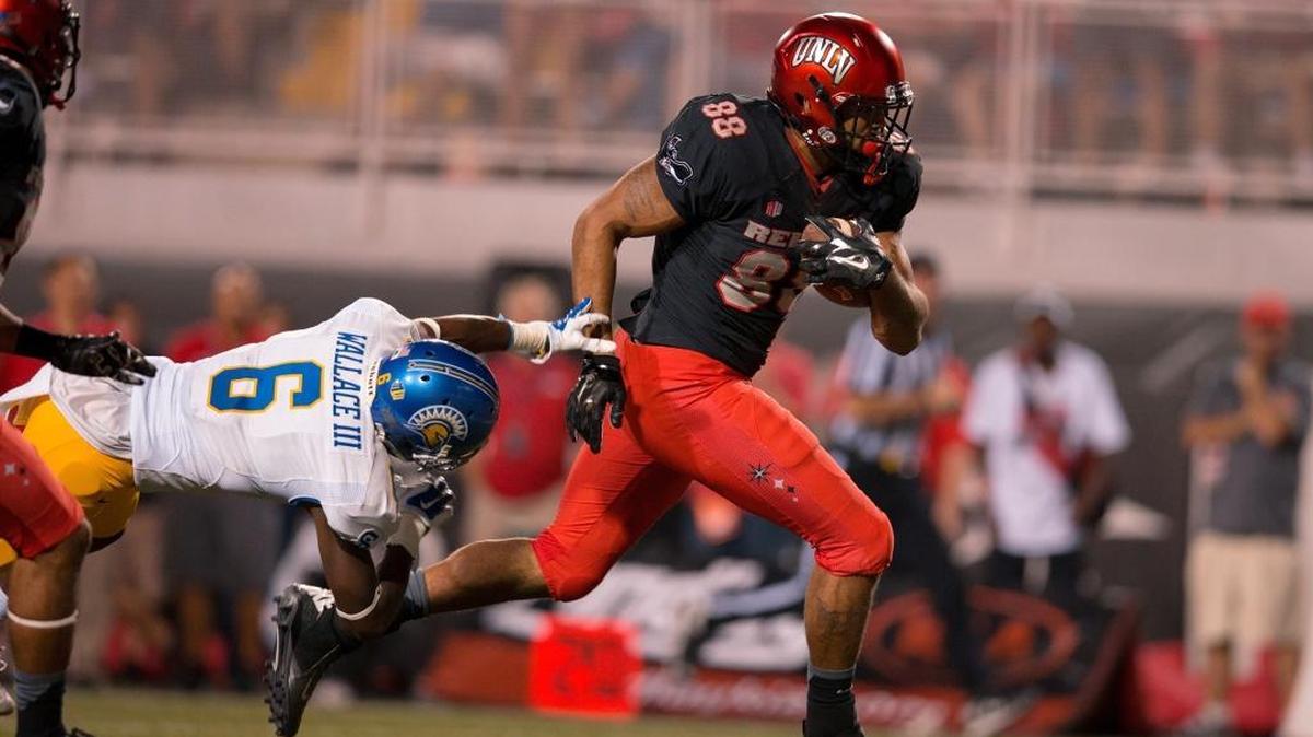 UNLV’s Andrew Price races through a tackle attempt by San Jose State’s Cleveland Wallace III in 2015. Price, a graduate of Blaine High School, hopes to be selected in the 2017 NFL Draft this weekend.