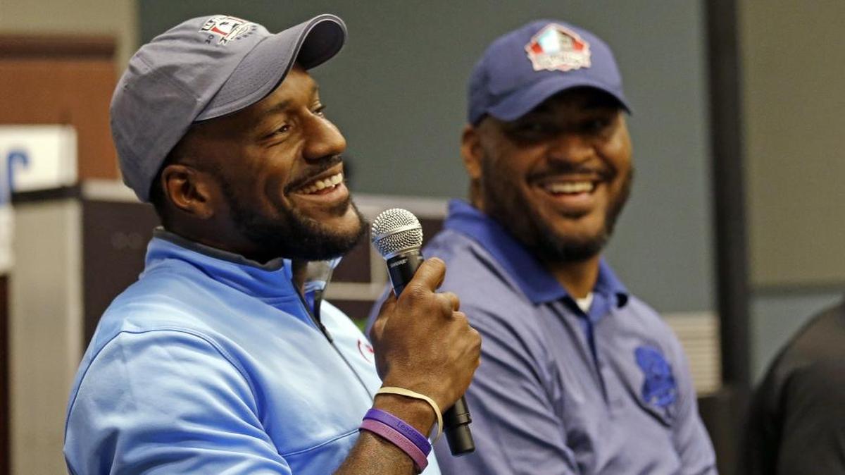 Former Seattle Seahawks’ players Jordan Babineaux, left, and Walter Jones address rookies during a panel discussion at the football team's training camp Monday, June 20, 2016, in Renton, Wash. The team is holding a rookie symposium for the new players to give them information about the NFL.