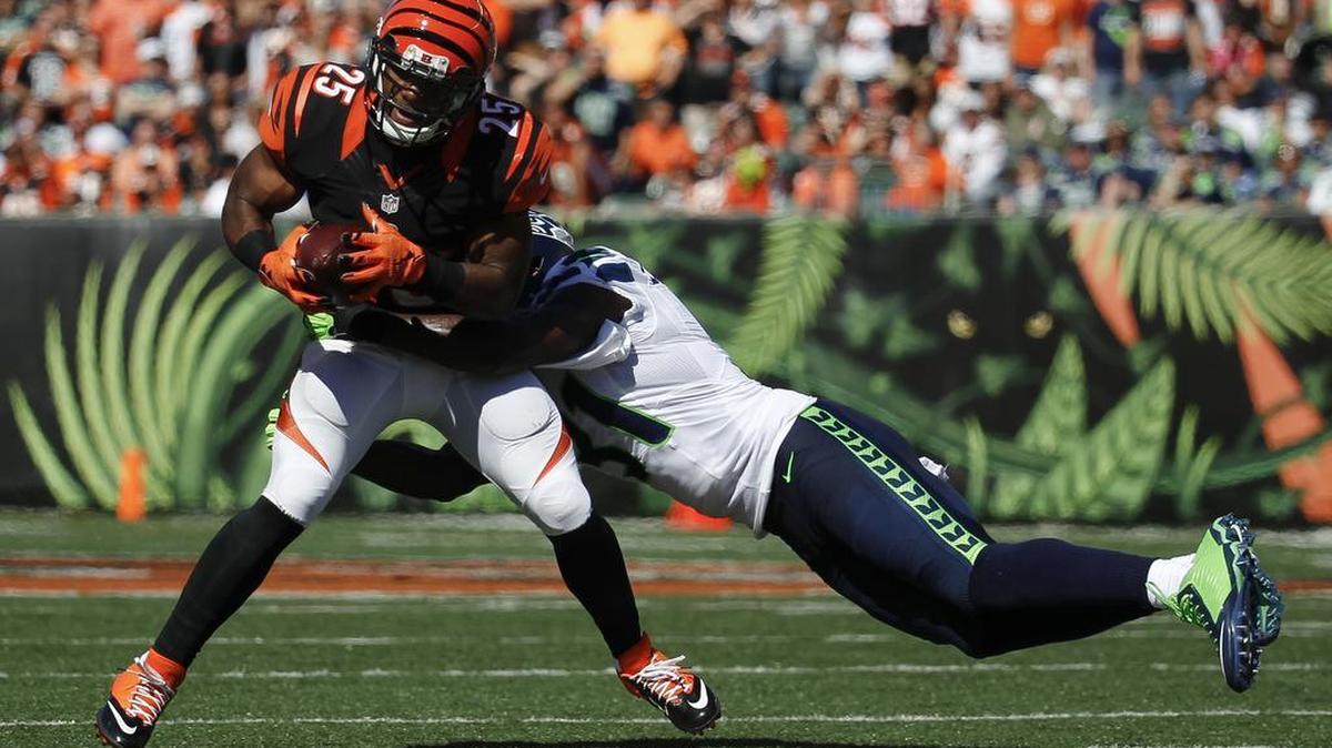 
Bengals running back Giovani Bernard is tackled by Seahawks safety Kam Chancellor. Chancellor had his worst game out of the three he has played since returning from a long holdout. Cincinnati targeted him often in the second half.
