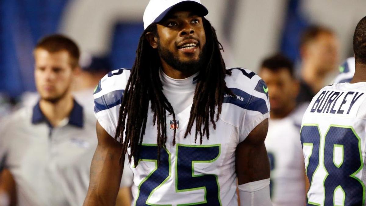 Seattle Seahawks cornerback Richard Sherman watches from the sidelines during the second half of an NFL preseason football game against the San Diego Chargers Saturday, Aug. 29, 2015, in San Diego. (AP Photo/Lenny Ignelzi)