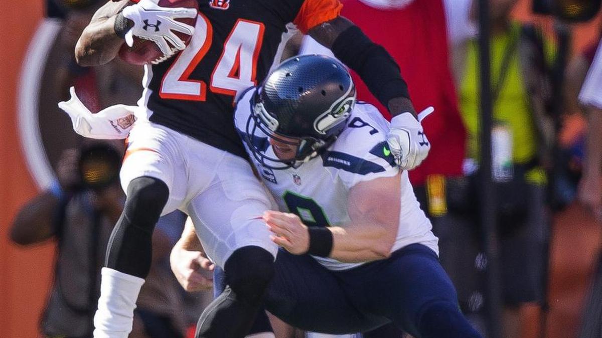 
Seattle Seahawks punter Jon Ryan tackles the Cincinnati Bengals' Adam Jones during the fourth quarter on Sunday. Ryan has taken issue with former NFL coach Brian Billick’s statement he made on the NFL Network that punters are not football players.
