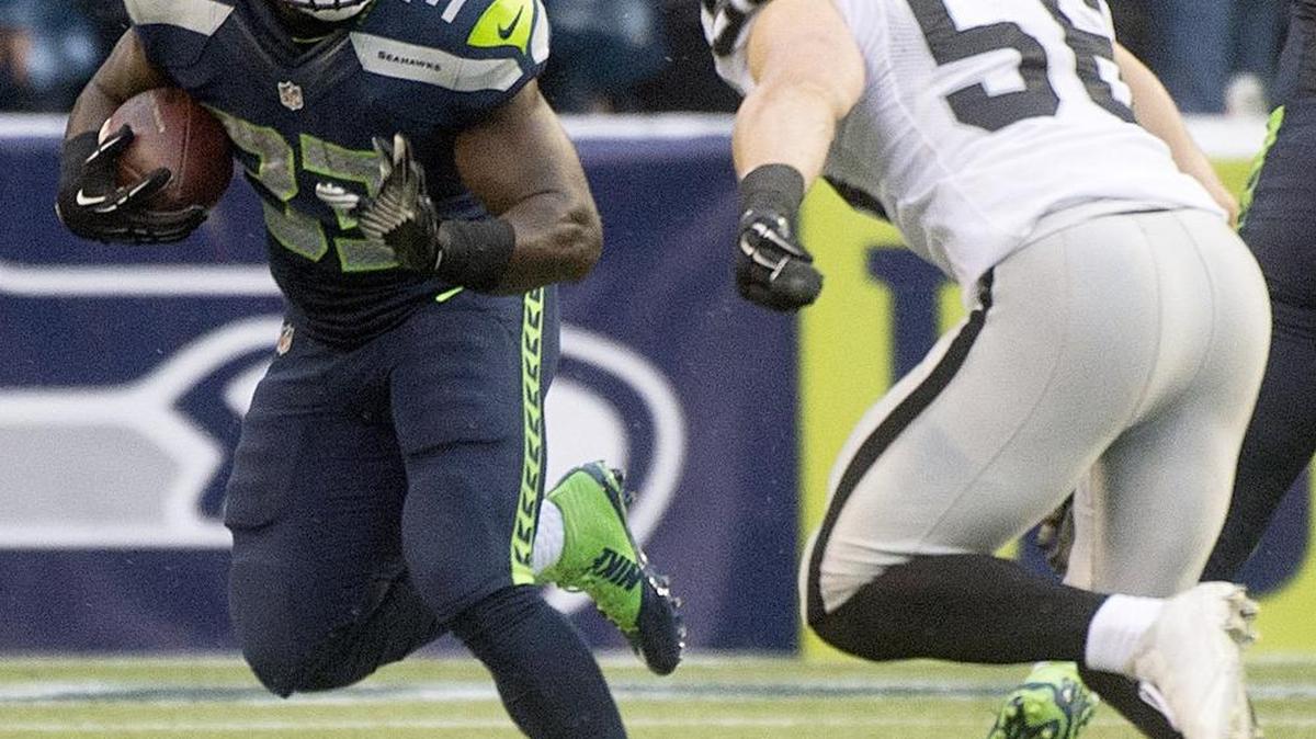 Seahawks running back Christine Michael, who was traded to Dallas in September, re-signed with the team Wednesday and could be the feature back down the stretch.