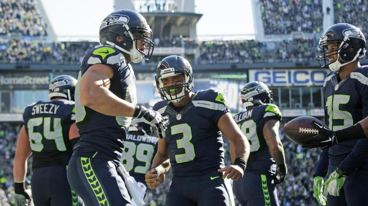 
Seattle Seahawks quarterback Russell Wilson (3) celebrates with tight end Jimmy Graham, left, after Graham caught a pass from Wilson for a touchdown against the Chicago Bears in the second half of an NFL football game, Sunday, Sept. 27, 2015, in Seattle.
