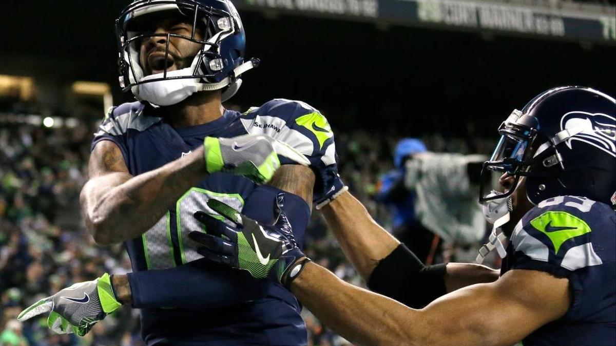Seattle Seahawks wide receiver Paul Richardson, left, celebrates after he caught a pass for a touchdown against the Detroit Lions in the first half of an NFL football NFC wild card playoff game, Saturday, Jan. 7, 2017, in Seattle.