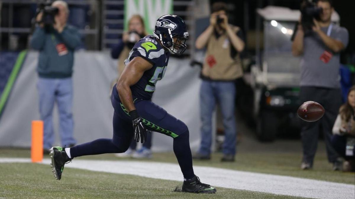 
Seattle Seahawks outside linebacker K.J. Wright watches as a fumble by Detroit Lions wide receiver Calvin Johnson goes out of the end zone late in the fourth quarter Monday night. 
