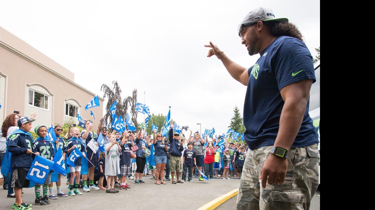
Seattle Seahawks fans greet Seahawks fullback Will Tukuafu at the start of the Bellingham stop of the Seahawks 12-Tour on Saturday, July 11, at The Best Western Lakeway Inn in Bellingham.
