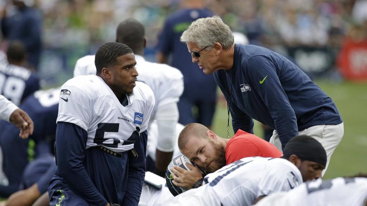 
Bobby Wagner, left, talks with Seattle Seahawks head coach Pete Carroll Monday at training camp. Wagner signed a 4-year, $43-million contract extension with the Seahawks earlier this week. 
