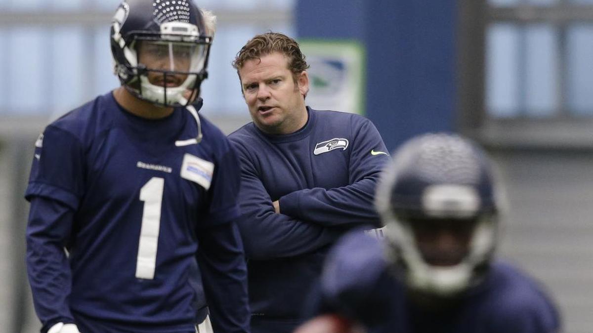 Seattle Seahawks general manager John Schneider looks on during a rookie minicamp workout Sunday, May 8, 2016, in Renton, Wash.