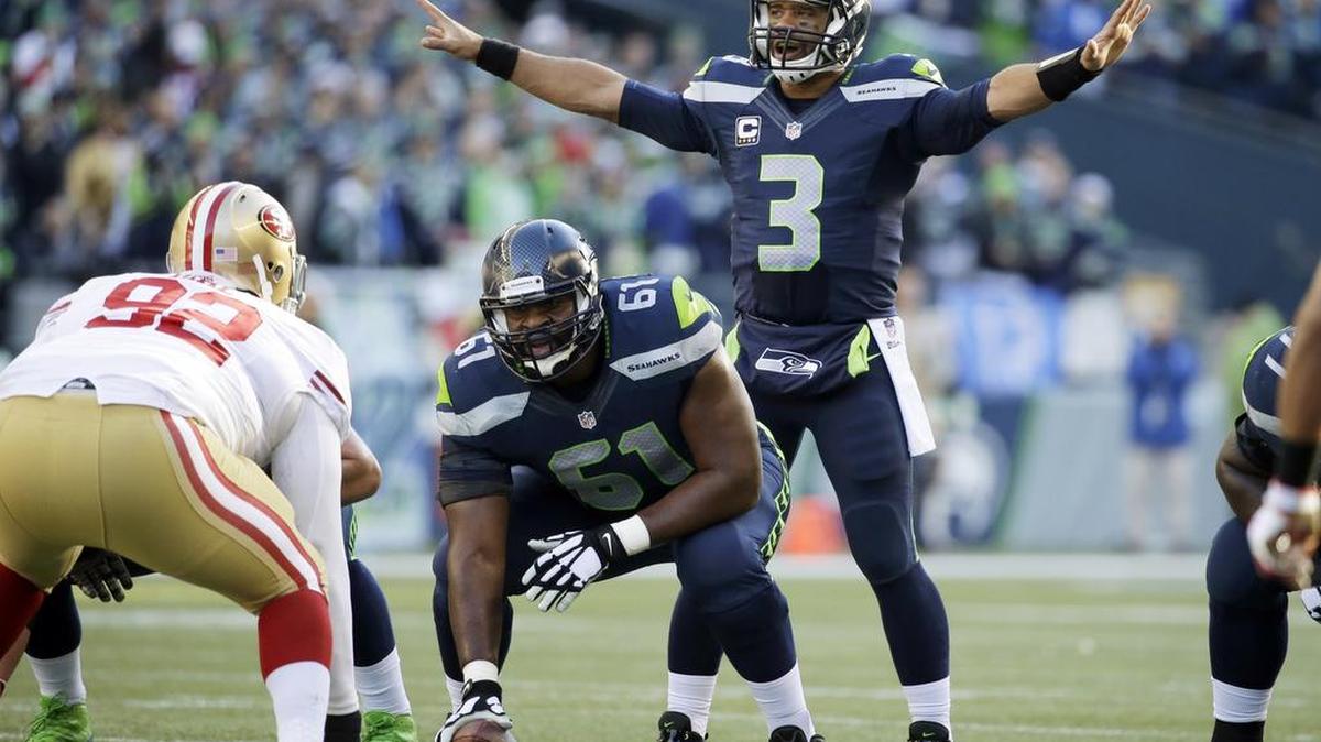 
Seahawks quarterback Russell Wilson calls to his team as he prepares to take a snap from center Lemuel Jeanpierre last season against the 49ers. Jeanpierre started three games last season. 
