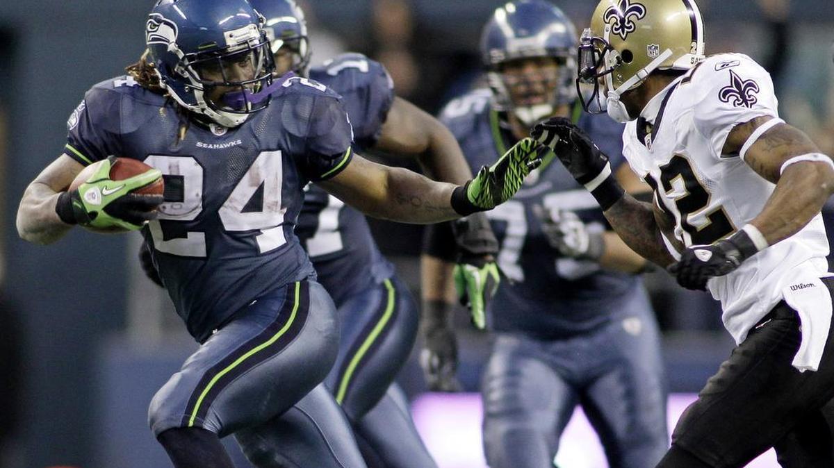 Seattle’s Marshawn Lynch (24) breaks away from the tackle of New Orleans Saints' Tracy Porter to score a touchdown in the second half of an NFC wild card playoff football game, Saturday, Jan. 8, 2011.