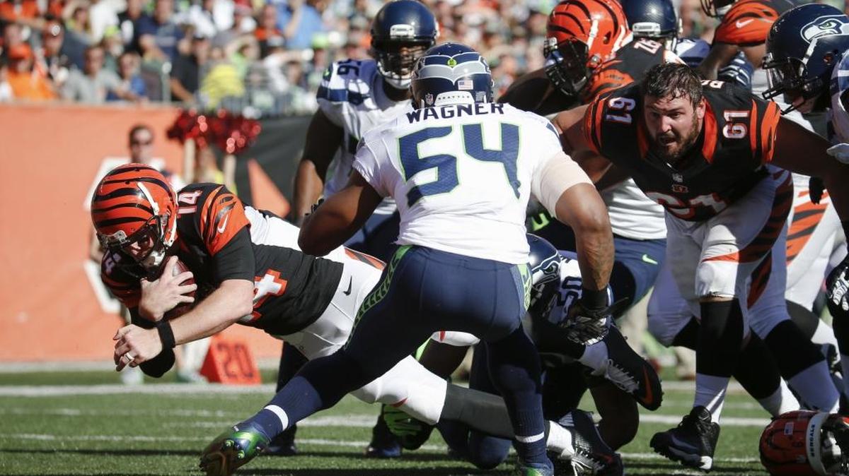 
Bengals quarterback Andy Dalton scores a touchdown last week, as Cincinnati rallied from a 17-point fourth-quarter deficit to defeat the Seahawks in overtime.
