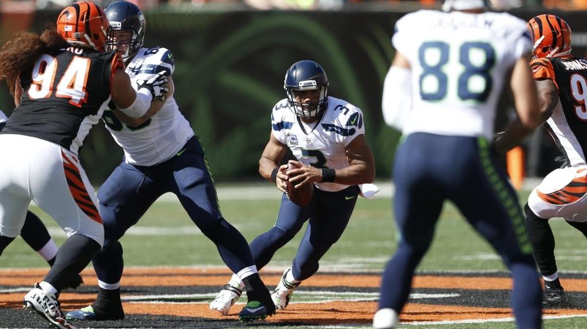 
Seattle Seahawks quarterback Russell Wilson (3) runs the ball in the first half. For most of the game against the Bengals on Sunday, the Seahawks line was putting together its best performance of the season.
