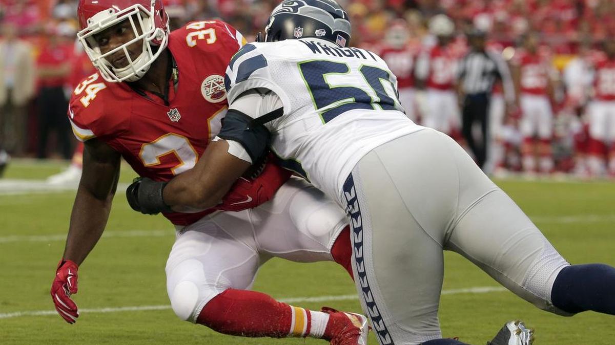 Seahawks linebacker K.J. Wright, right, is having his best season in Seattle, leading the team in tackles and earning praise from his teammates and coach Pete Carroll.