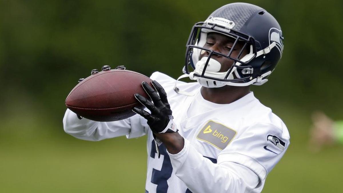 
Seattle Seahawks safety Dion Bailey works drills during an organized team activity practice in Renton in 2014. Bailey has moved up to the team’s top safety spot with Kam Chancellor holding out.
