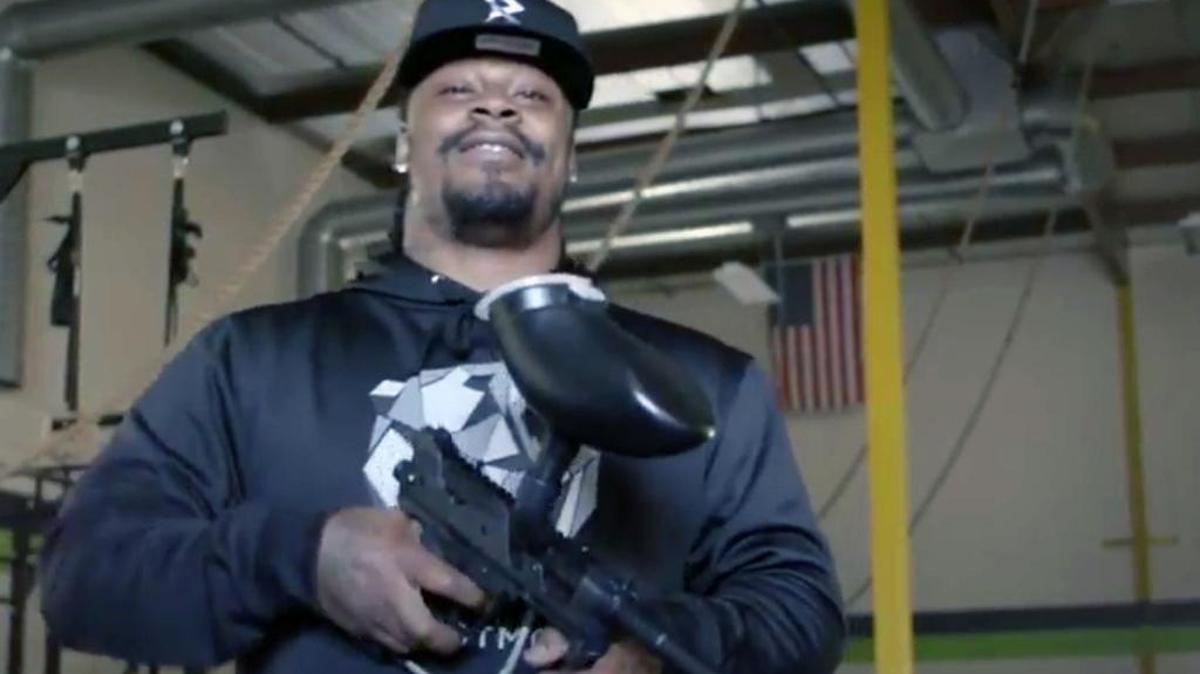 Former Seattle Seahawks running back Marshawn Lynch is featured in a new video giving fans a chance to play paintball by donating to his charity, 1stFam Family Foundation.