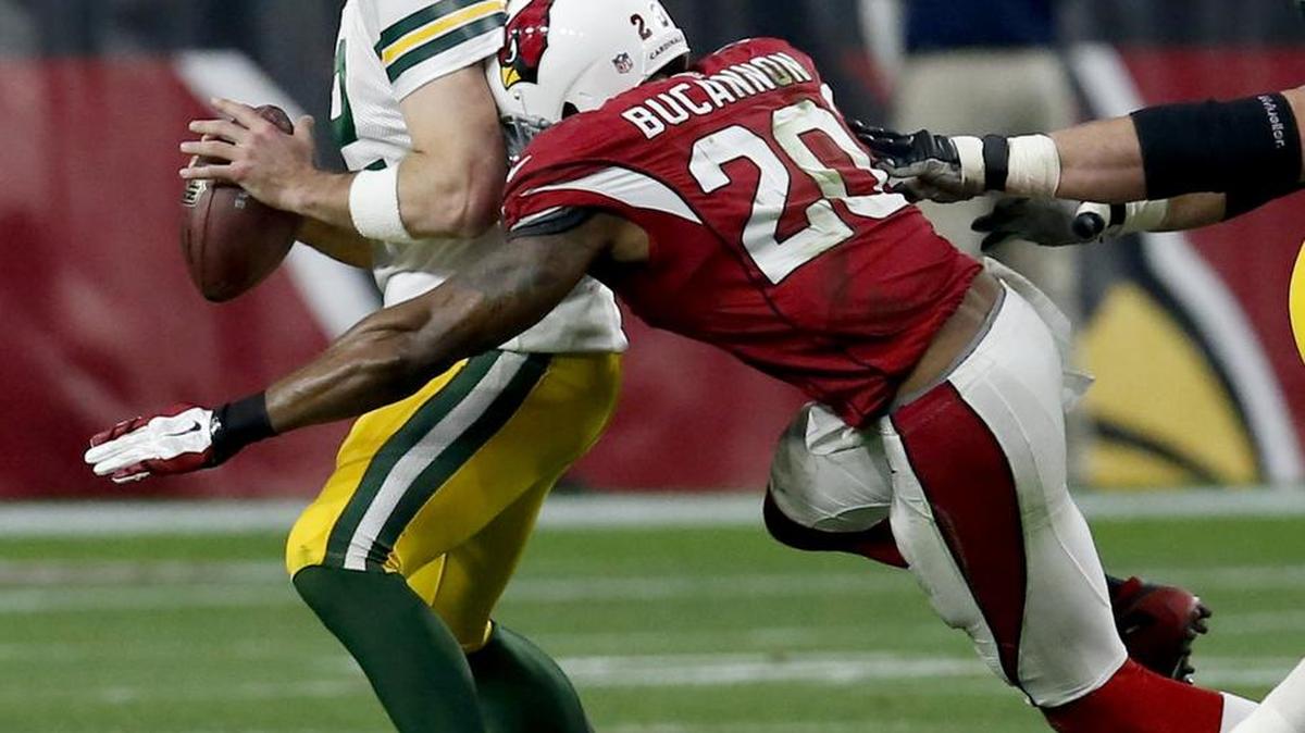 Green Bay Packers quarterback Aaron Rodgers (12) fumbles as he is sacked by Arizona Cardinals strong safety Deone Bucannon (20) during the second half of an NFL football game, Sunday, Dec. 27, 2015, in Glendale, Ariz. The Packers recovered the football.