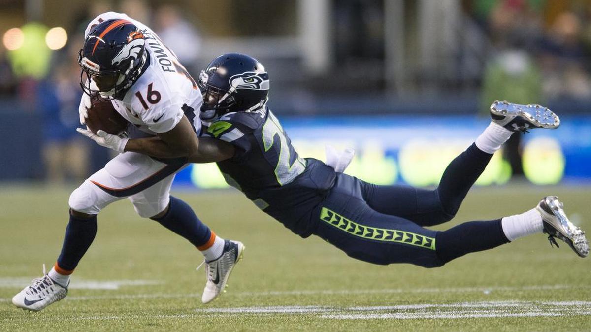 
Seattle Seahawks cornerback Tye Smith tackles Denver Broncos wide receiver Bennie Fowler during an exhibition game on Friday, Aug. 14, at CenturyLink Field in Seattle, Wash.
