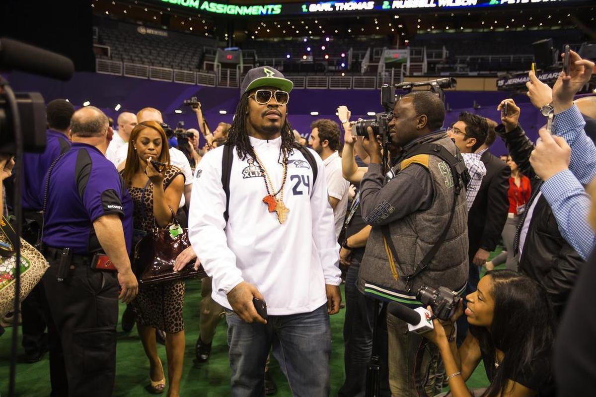 Marshawn Lynch makes an entrance at Media Day for the Super Bowl on Tuesday, Jan. 27, 2015.