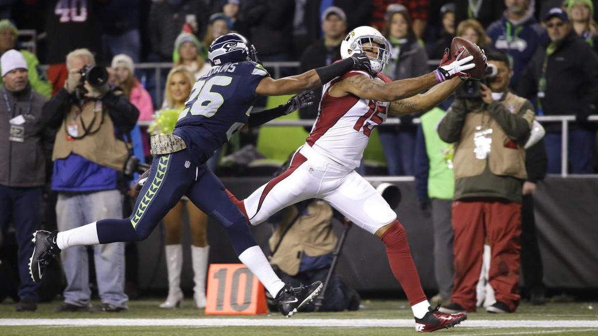 Cardinals wide receiver Michael Floyd, right, catches a touchdown pass as Seahawks cornerback Cary Williams defends earlier this season. On Monday, the Seahawks released Williams after he was inactive the last two games.
