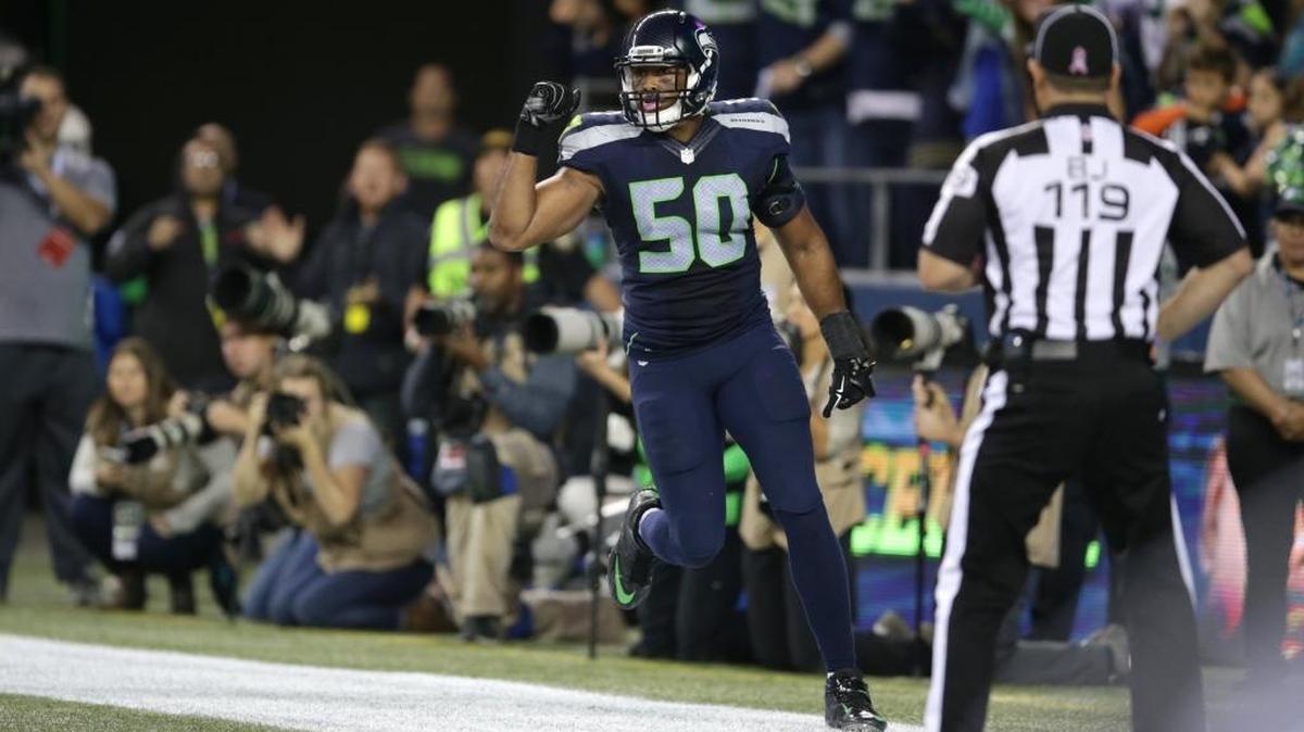 
Seahawks outside linebacker K.J. Wright celebrates batting Calvin Johnson’s fumble out of the end zone late in the fourth quarter that resulted in a disputed touchback and gave Seattle a victory over Detroit on Monday. 
