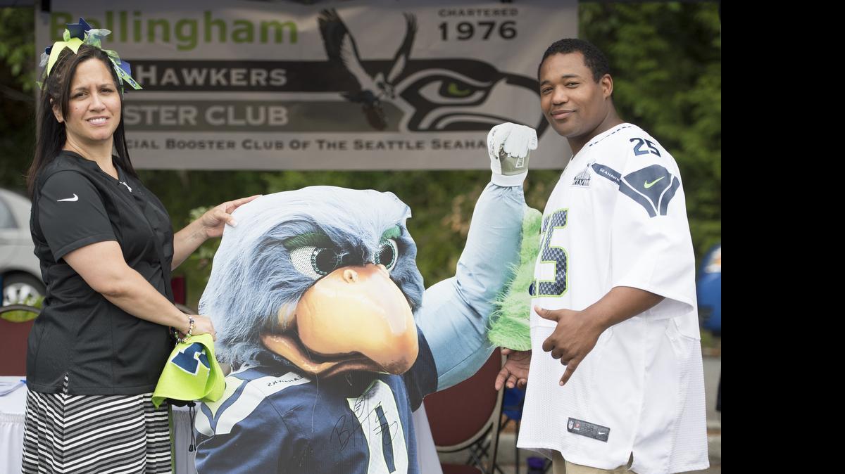 
The Bellingham Sea Hawkers Booster Club hosts a booth at the 2014 Seahawks rally.
