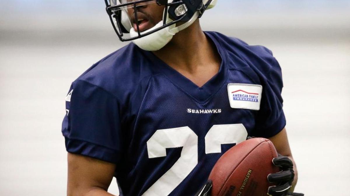 Seattle Seahawks' C.J. Prosise holds the ball during a rookie minicamp workout Sunday, May 8, 2016, in Renton, Wash.