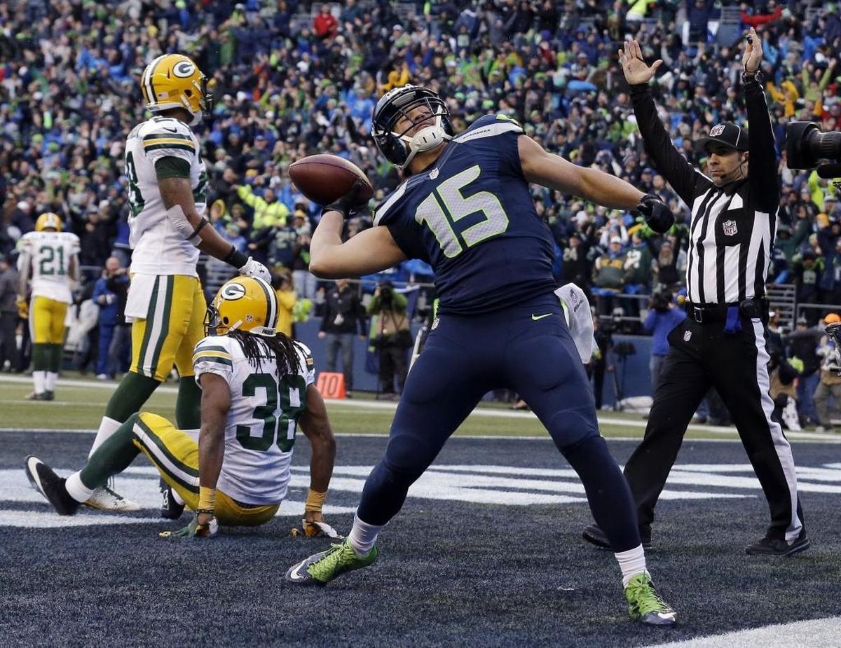 Then-Seahawks wide receiver Jermaine Kearse celebrates by firing the ball into CenturyLink Field shaking stands after his touchdown catch in overtime beat the Green Bay Packers in the NFC championship game on Jan. 18, 2015. Kearse, from Lakewood and the University of Washington, told Seattle’s KJR-AM radio he’d “love” to return to the Seahawks as as a free agent after two seasons with the New York Jets.