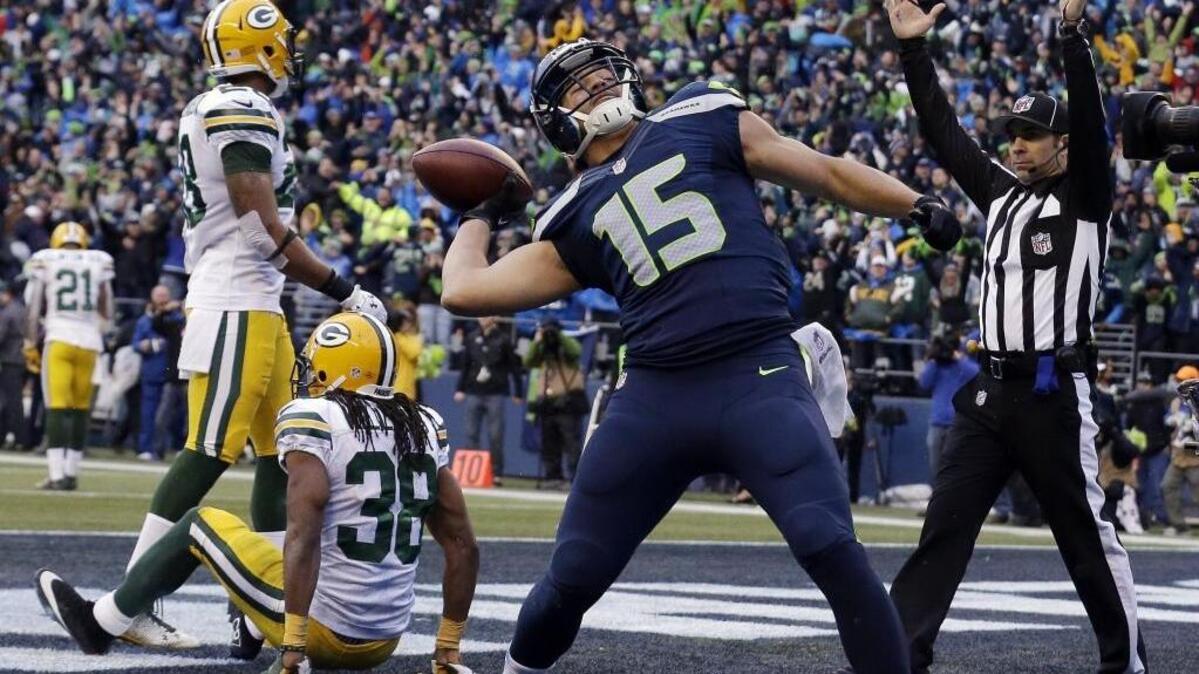 Then-Seahawks wide receiver Jermaine Kearse celebrates by firing the ball into CenturyLink Field shaking stands after his touchdown catch in overtime beat the Green Bay Packers in the NFC championship game on Jan. 18, 2015. Kearse, from Lakewood and the University of Washington, told Seattle’s KJR-AM radio he’d “love” to return to the Seahawks as as a free agent after two seasons with the New York Jets.