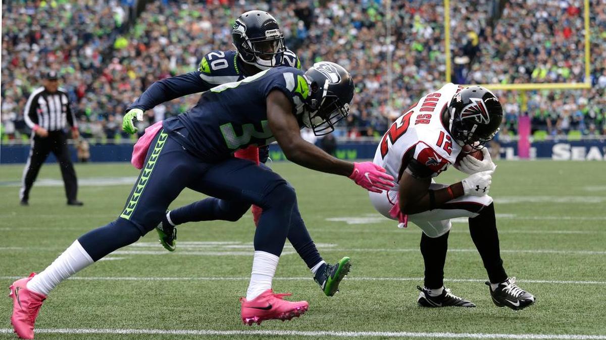 Atlanta Falcons wide receiver Mohamed Sanu, right, gets across the goal line ahead of Seattle Seahawks strong safety Kelcie McCray, center, and cornerback Jeremy Lane (20) for a touchdown Sunday, Oct. 16, in Seattle. McCray will be playing in place of the injured Kam Chancellor on Sunday, Oct. 23, at Arizona.
